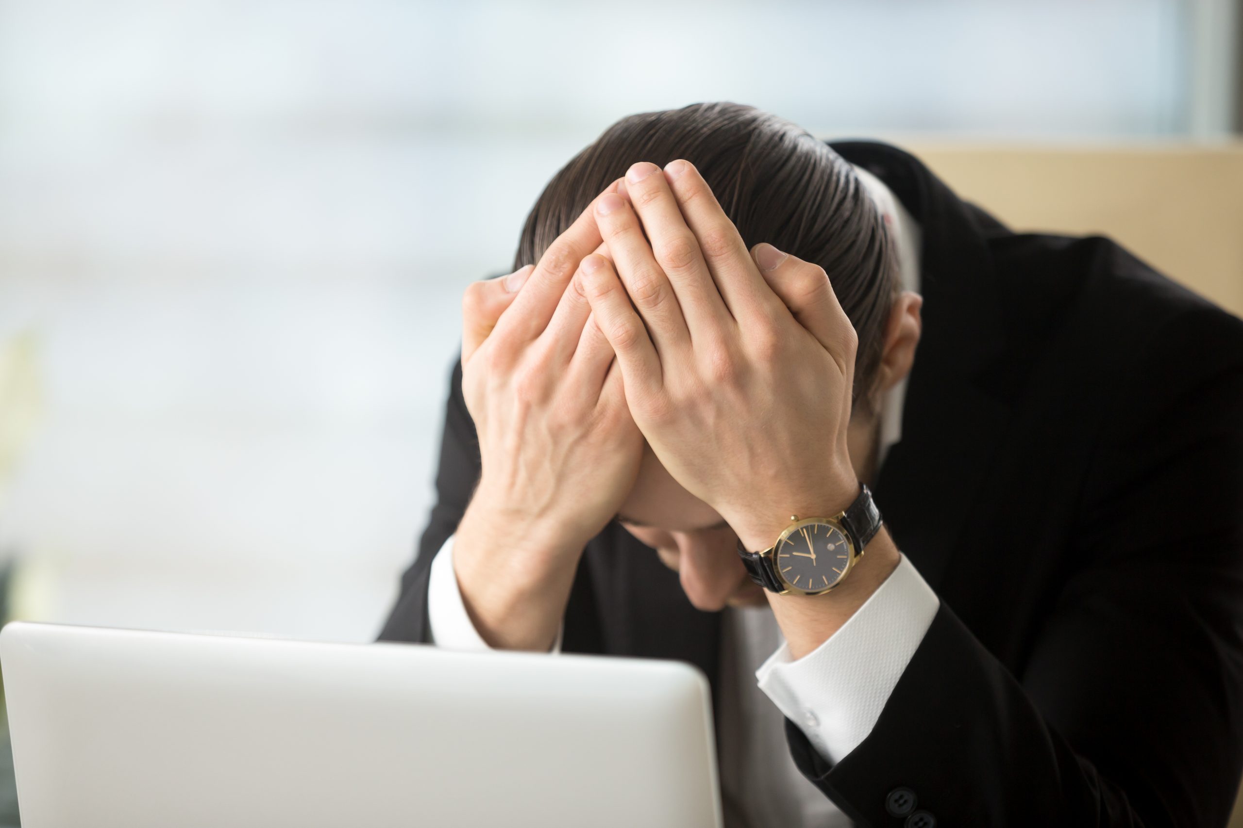 Businessman shocked because of company bankruptcy